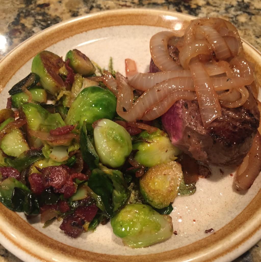 family dinner steak and onions brussels sprouts