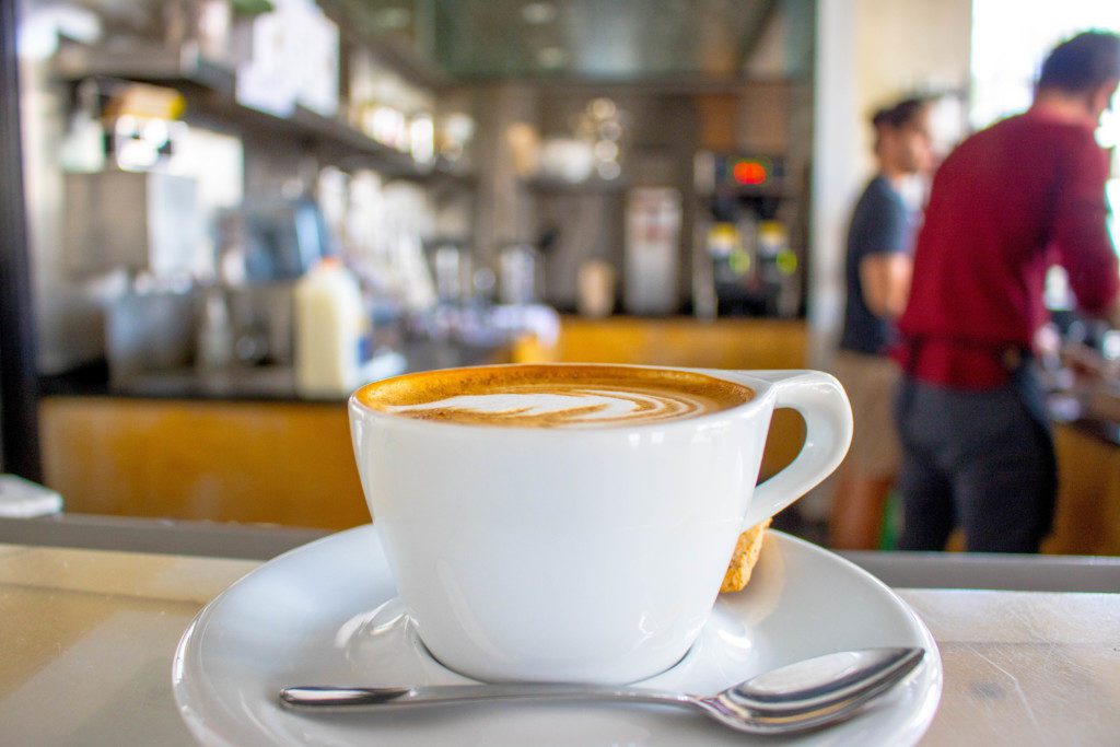 fresh cappuccino in a white barrio logan mug