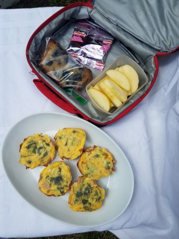 eggs baked in muffin tins, fruit snacks, Passover friendly bread, and apple slices