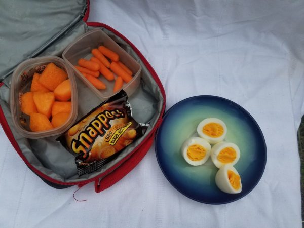 Hardboiled eggs, Passover snacks, cantaloupe, and carrots