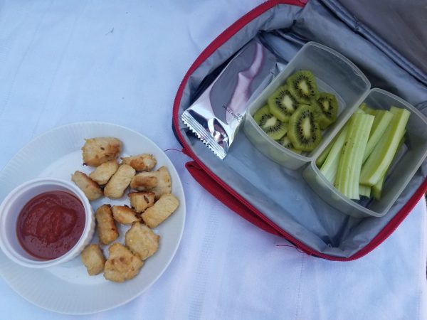 Parmesan chicken nuggets with kiwi, celery, and a Passover friendly granola bar