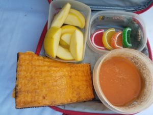 Tomato soup, cheese on matzah, apple slices, and jelly fruit slices