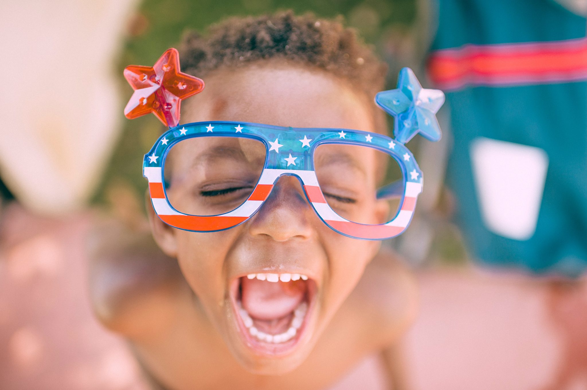 Boy wearing American flag frames with stars