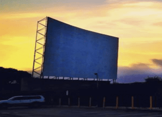 drive-in theater screen at dusk