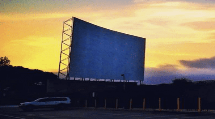 drive-in theater screen at dusk
