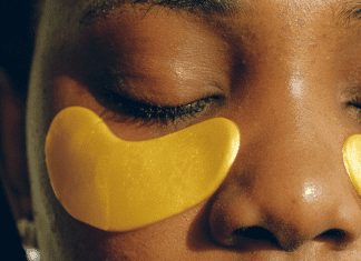 African American woman wearing gold under eye gel masks