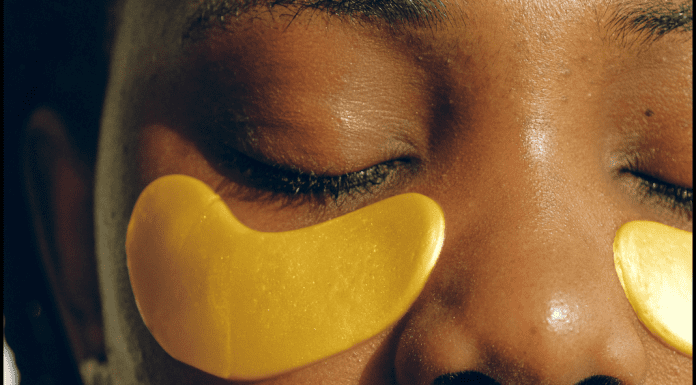 African American woman wearing gold under eye gel masks