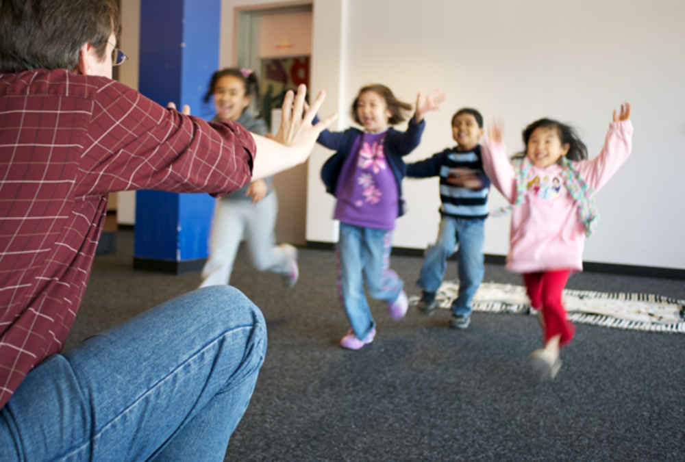 students running toward bach to rock instructor