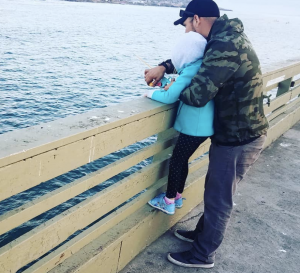 fishing on a pier - father and child