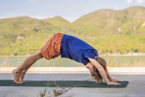 boy does downward dog yoga screen-free activities