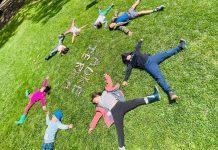 kids laying in grass at camp