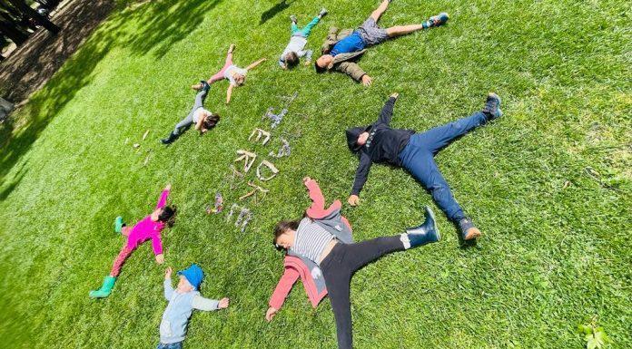 kids laying in grass at camp