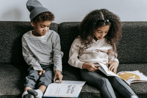 Kids Reading on Sofa