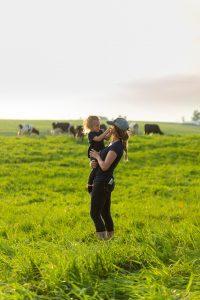 mother and child in cow pasture