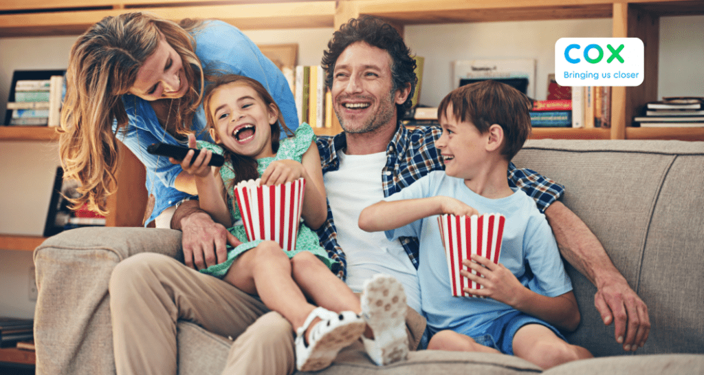 family watching movie from couch