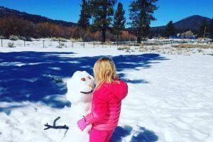 Child Building a Snowman