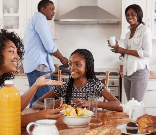 teenagers over breakfast with parents