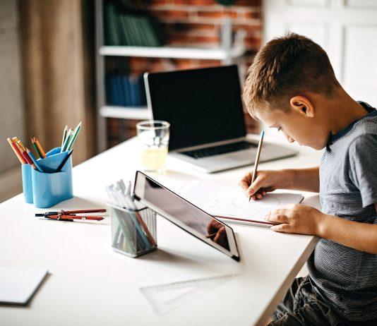 child doing homework online