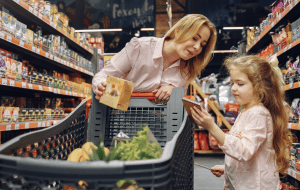 Girl Helps Mom with Grocery Shopping