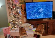 Streaming movies by the Christmas tree