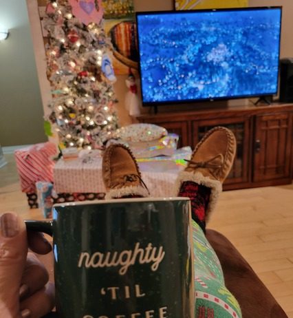 Streaming movies by the Christmas tree