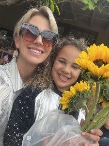 mom daughter with flowers for teacher gift
